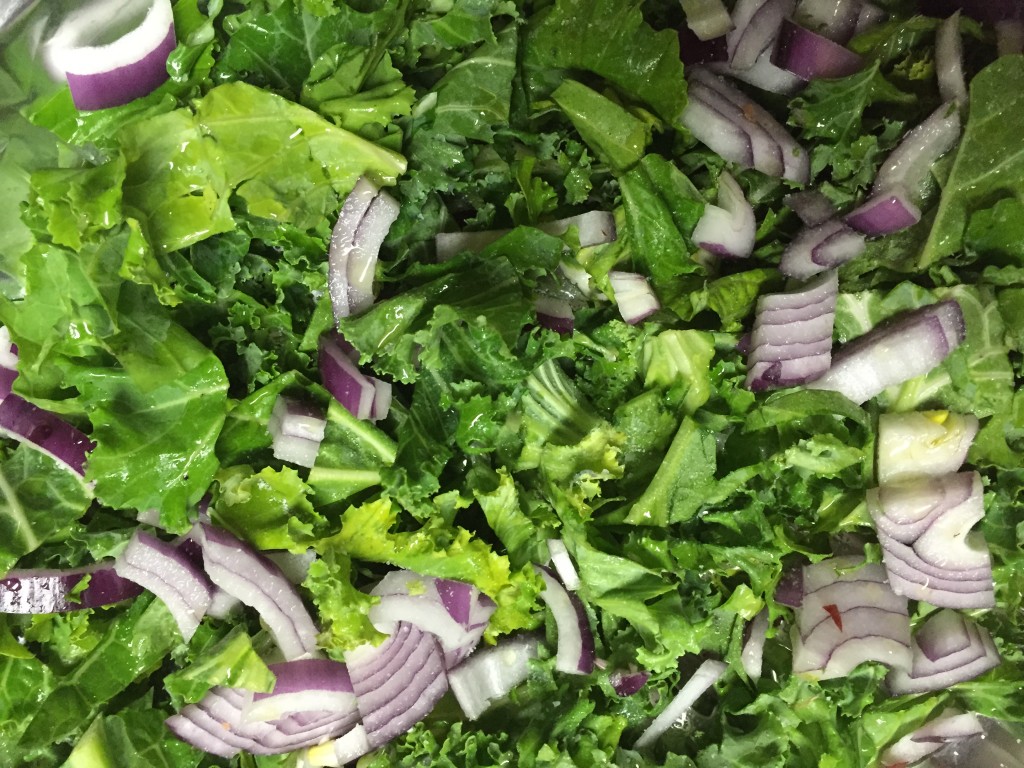 The start of kale with red onion and feta